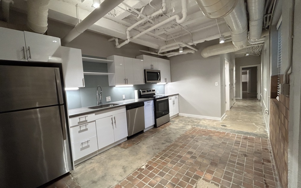Marine Central – 002  - 1 bedroom floorplan layout with 1 bathroom and 864 square feet (Kitchen
)